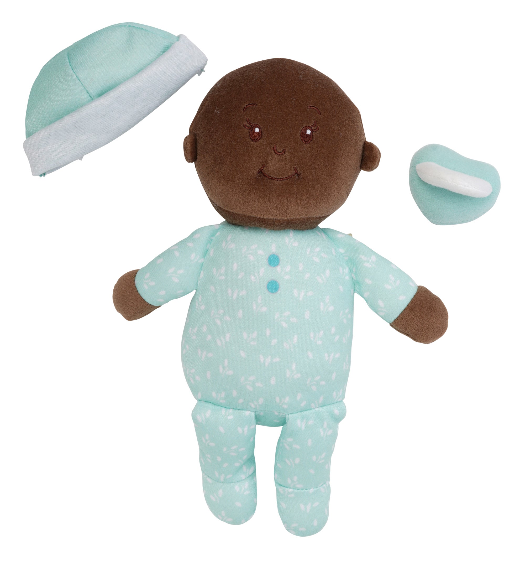 brown skinned soft baby doll with removable blue beanie and blue magnetic pacifier off to side of doll