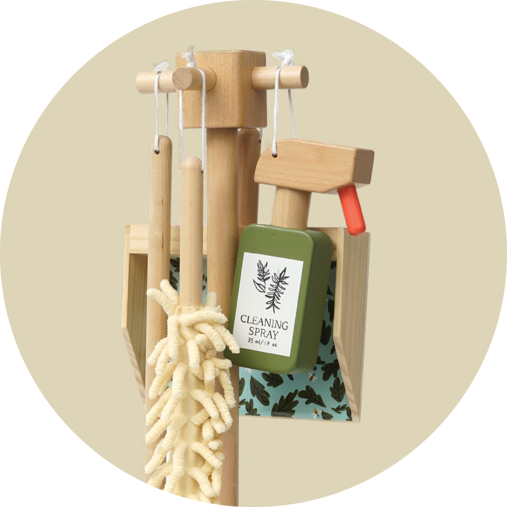 wooden cleaning toys hanging on a wooden hanger with pegs