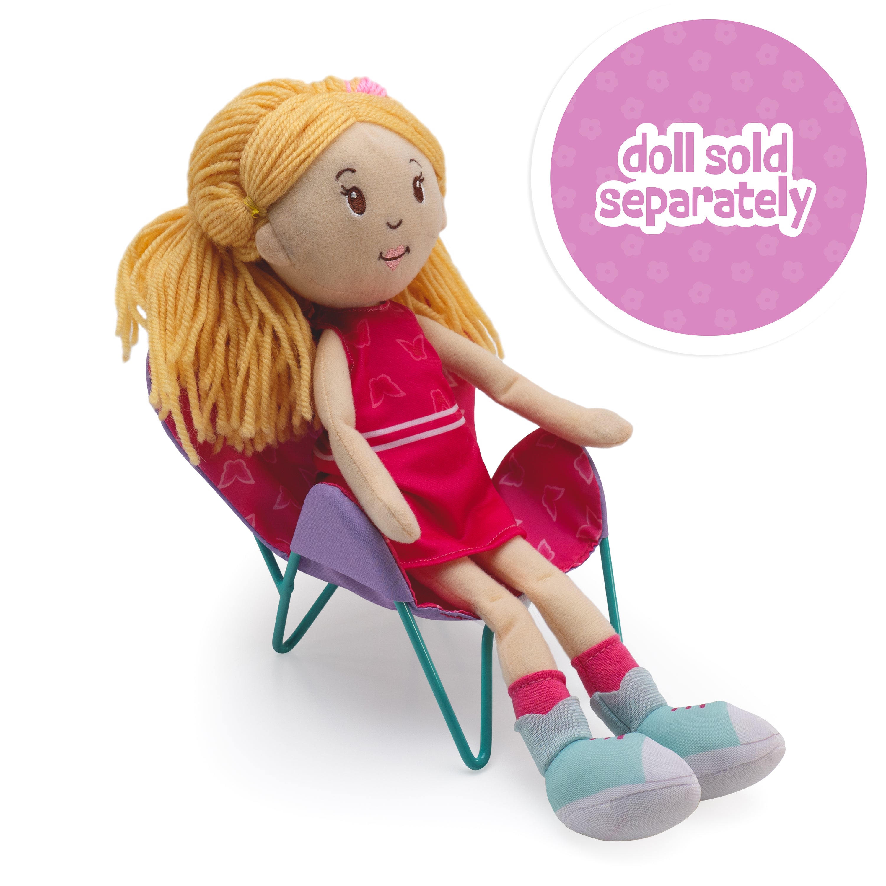 Doll sitting in pink Groovy Girls butterfly chair with butterfly pattern