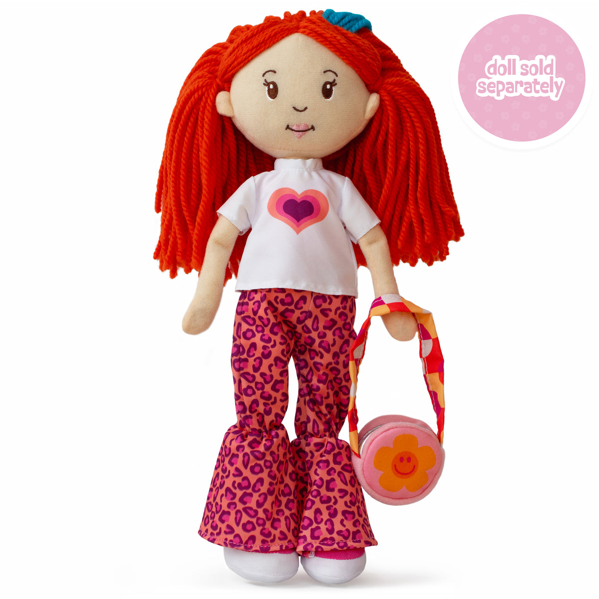 soft doll wearing a white t-shirt with a colorful heart, pink animal print pants, and flower purse.
