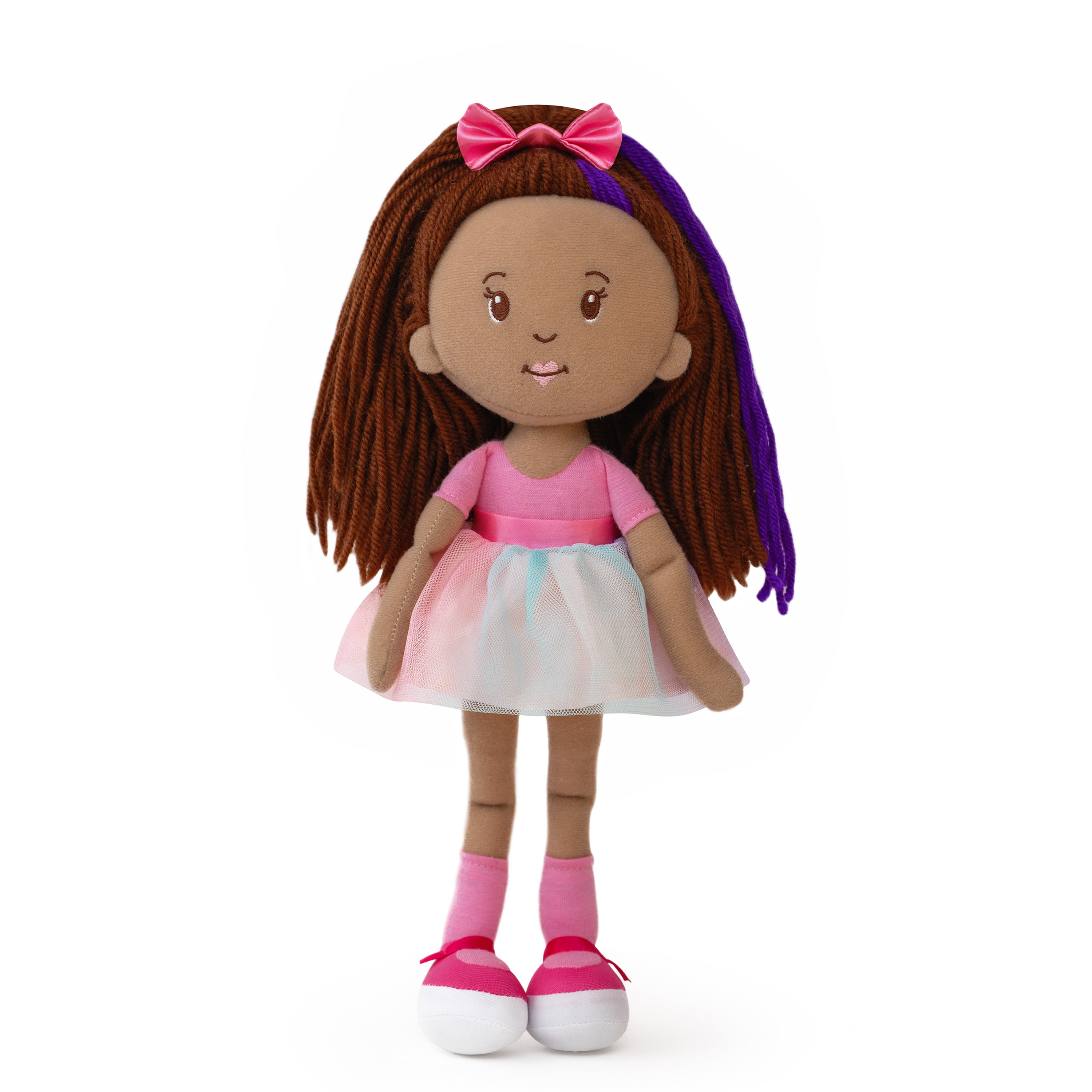 Doll with brown hair, pink dress, and pink bow on a white background