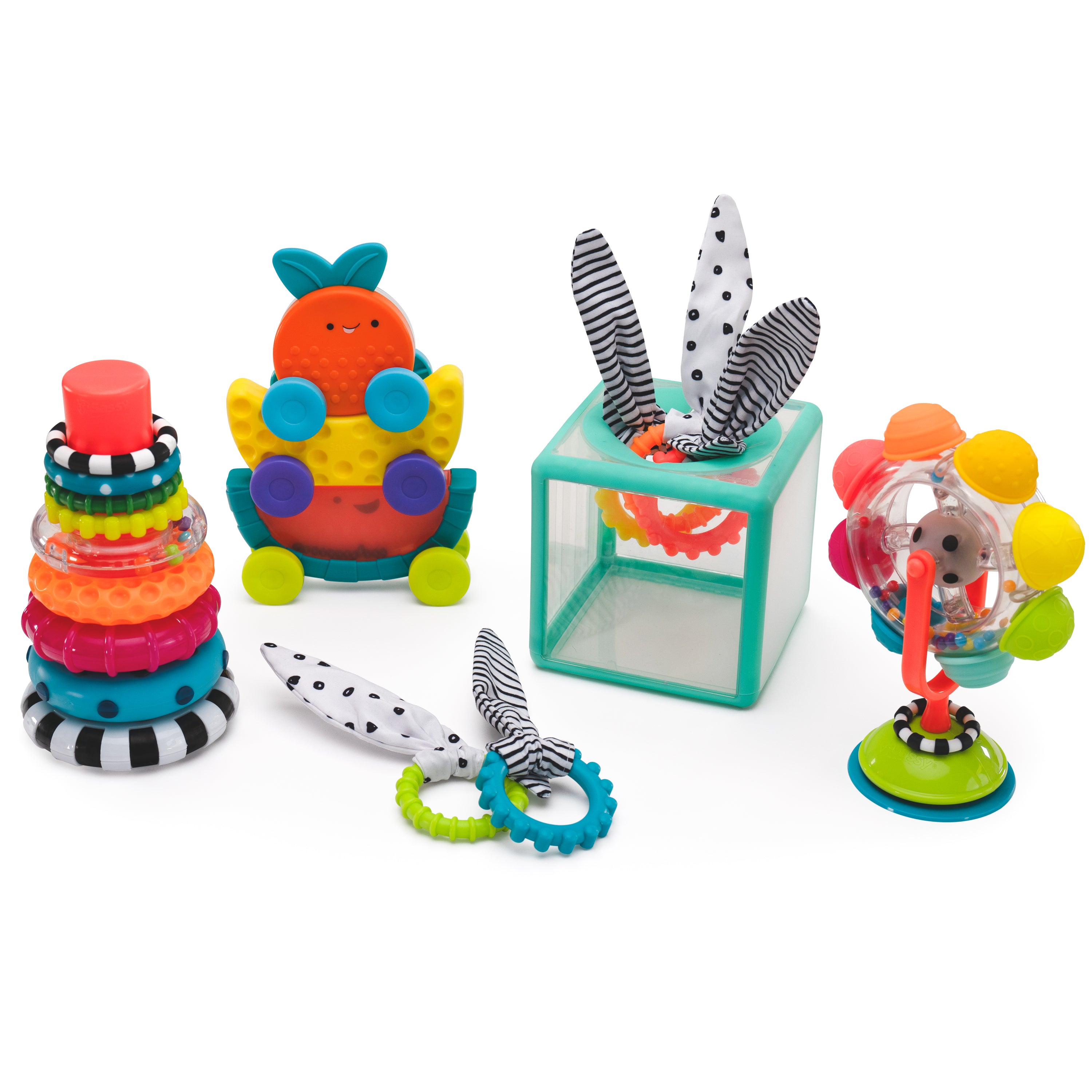 Assorted colorful baby toys on a white background