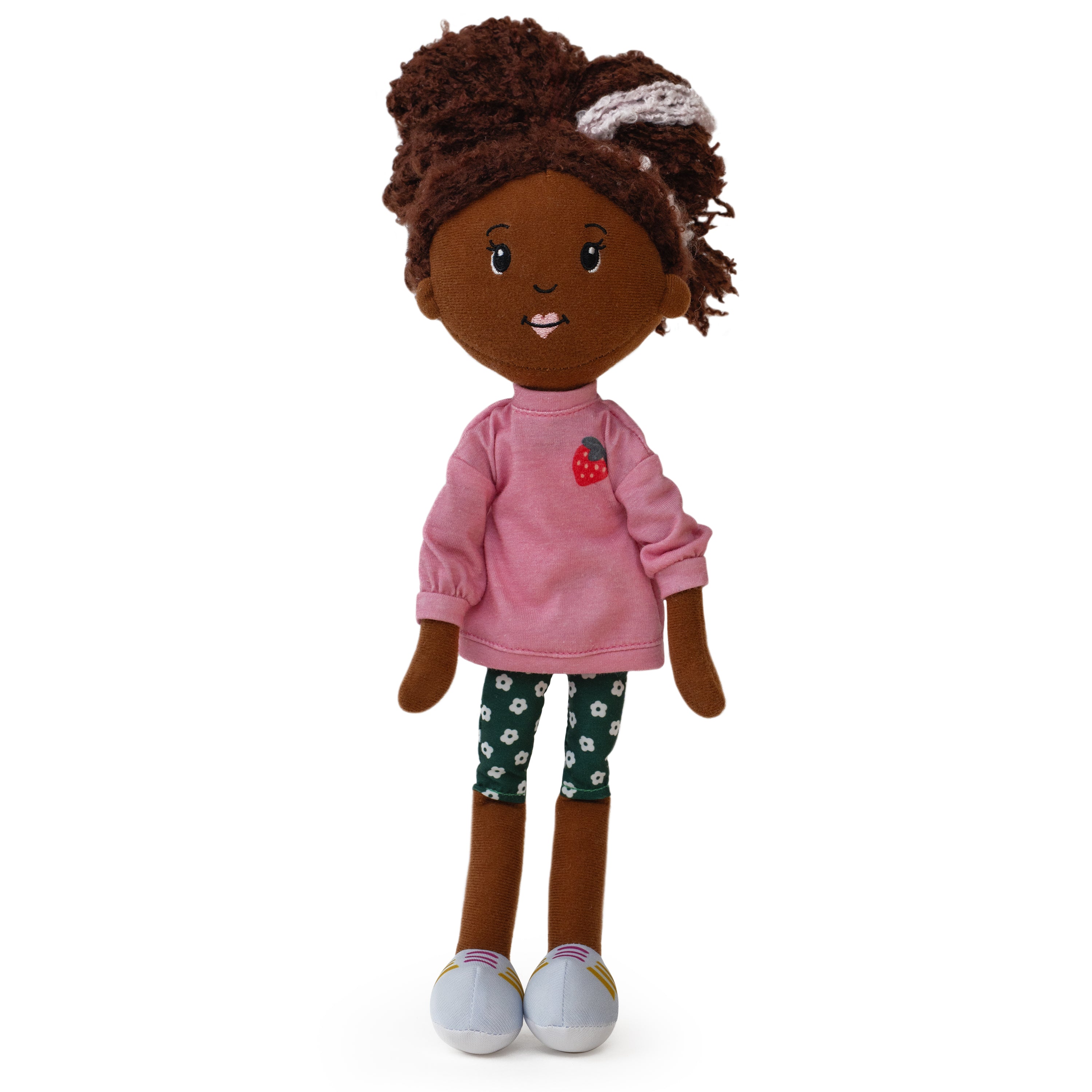 Plush doll with pink shirt and floral pants on a white background