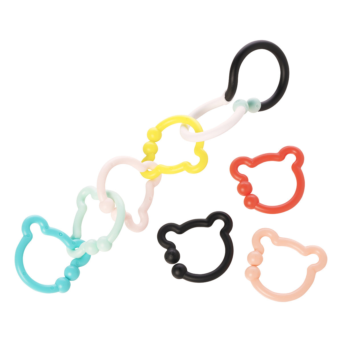 A black and white S-shaped hook connected to 4 colorful bear-shaped rings while 3 rings lay to the side.