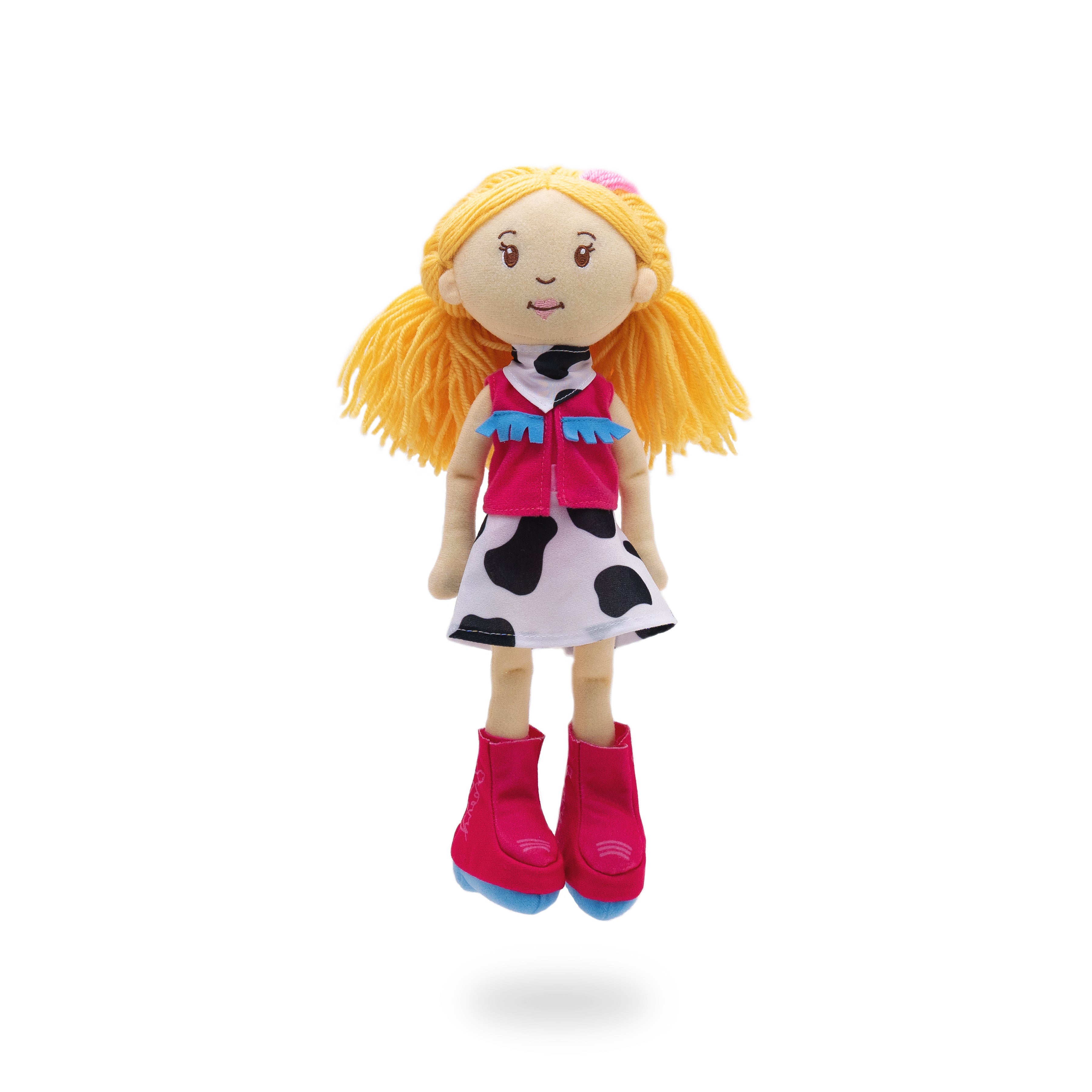 Soft doll wearing a pink vest, cow-print skirt, cowgirl boots, and a bandana.