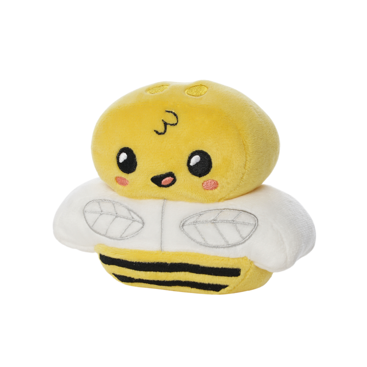 Soft plush toy shaped like a smiling yellow bumblebee with white wings, pink cheeks, and black stripes on its body.