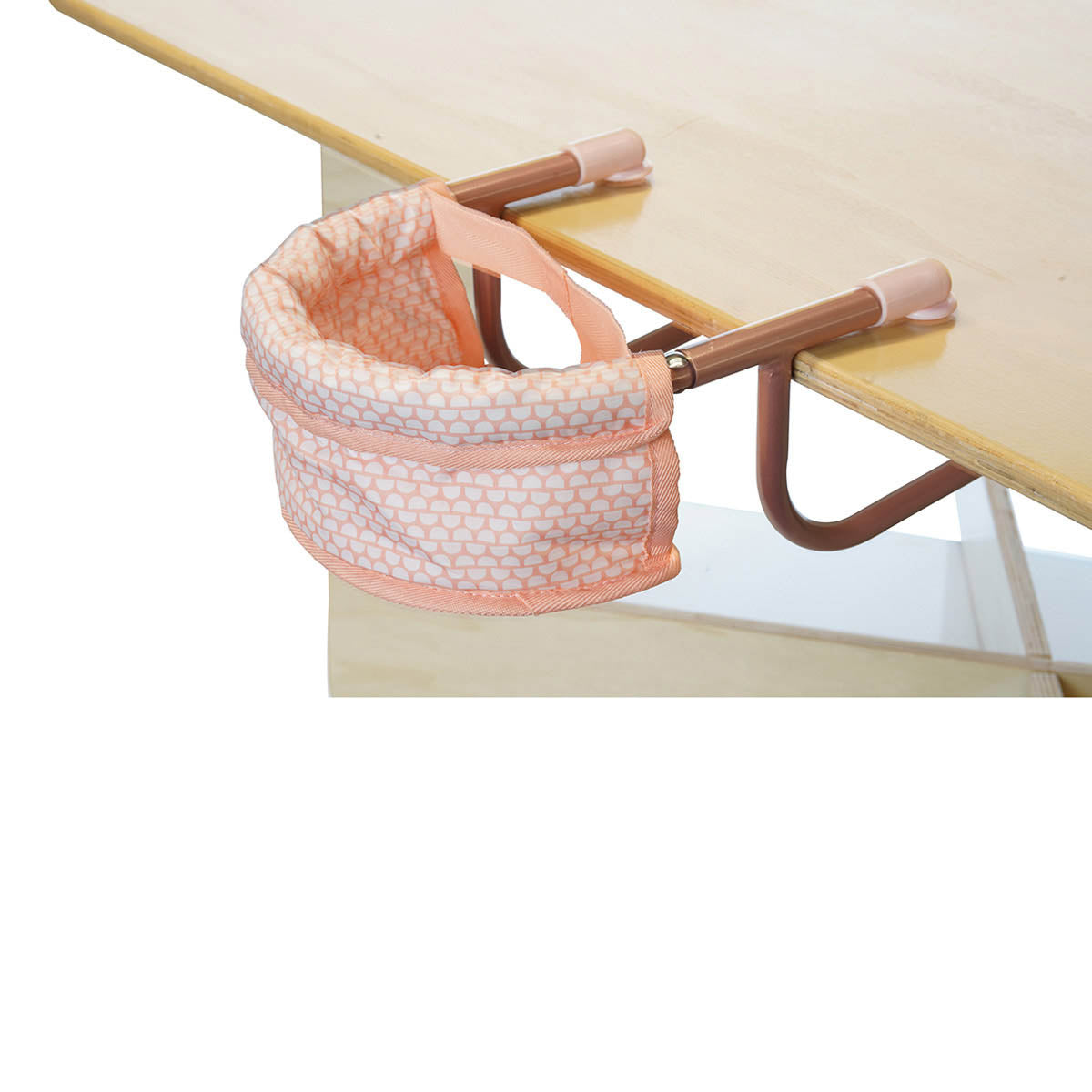 An aluminum pink doll table chair attached to a table.