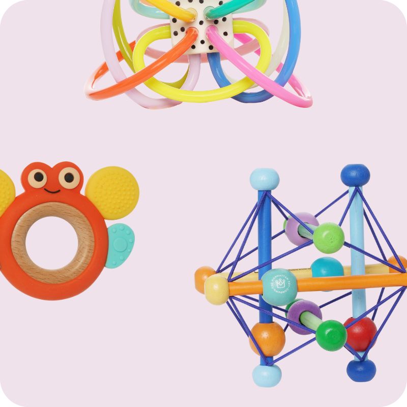 3 colorful infant rattles, and teether toys on a soft pinkish purple background