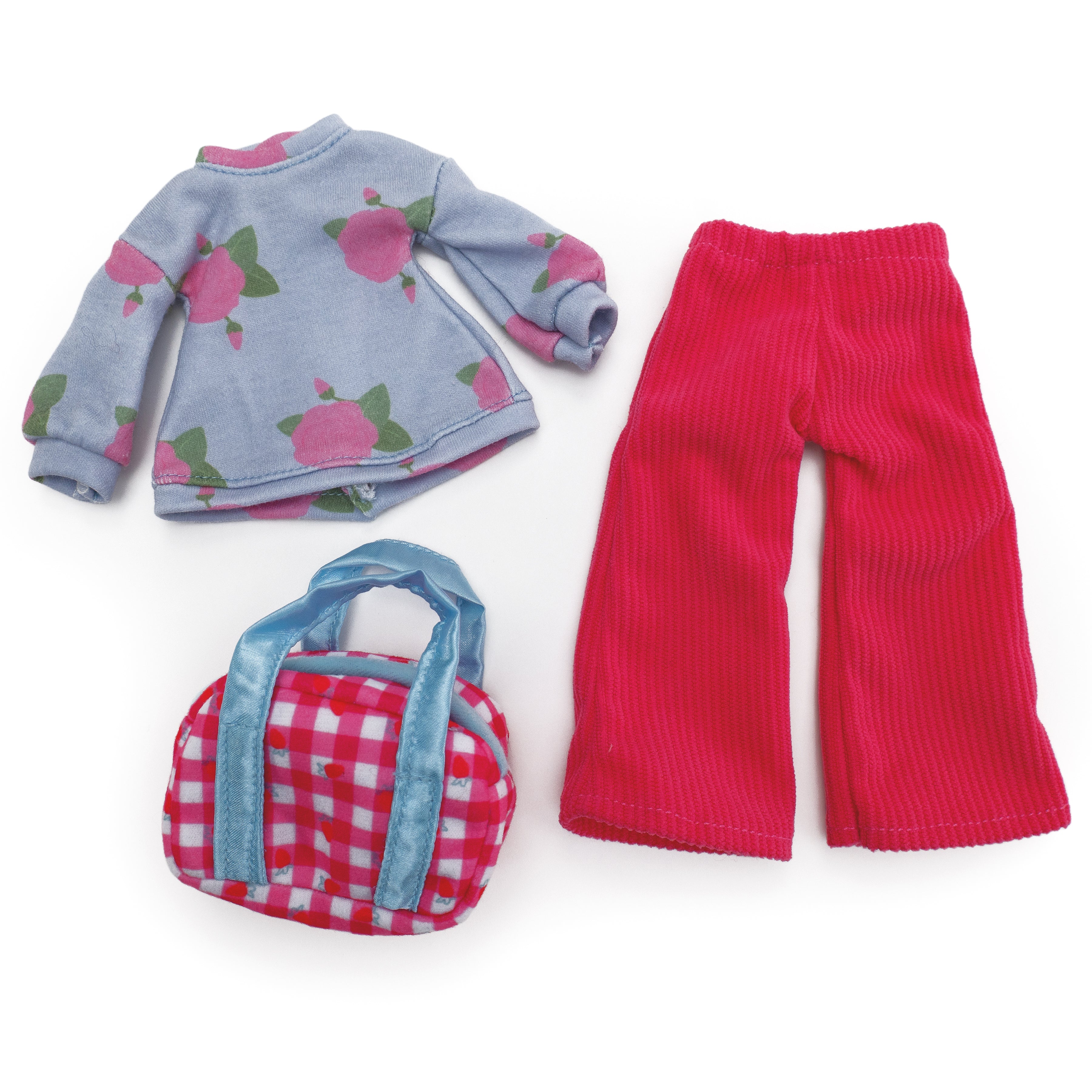 Floral patterned doll shirt with pink corduroy pants and a pink duffel bag.