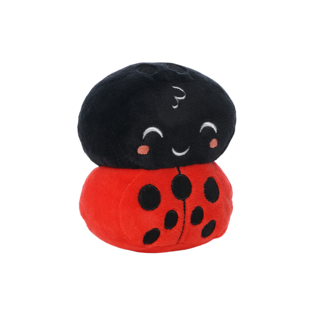 Plush ladybug toy with a black head, red body, black spots, and a smiling embroidered face.