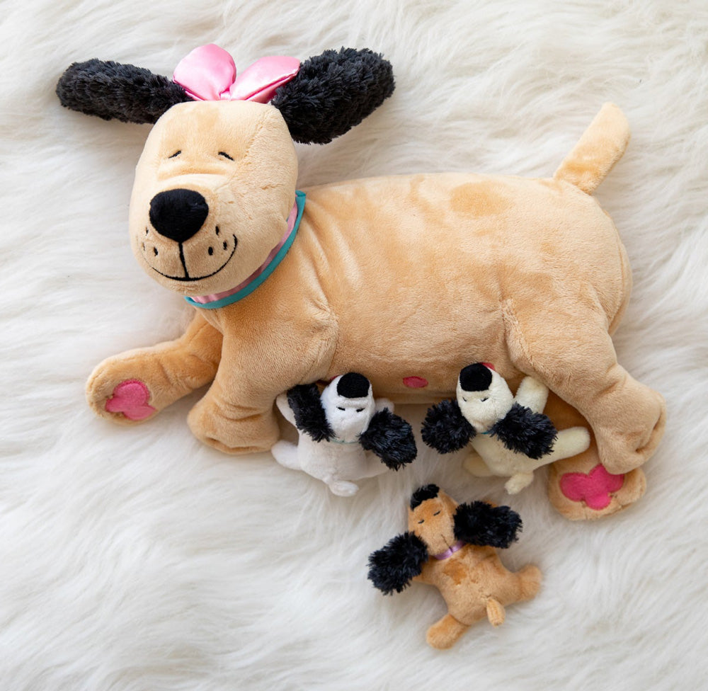 nursing dog plush toy on furry white carpet