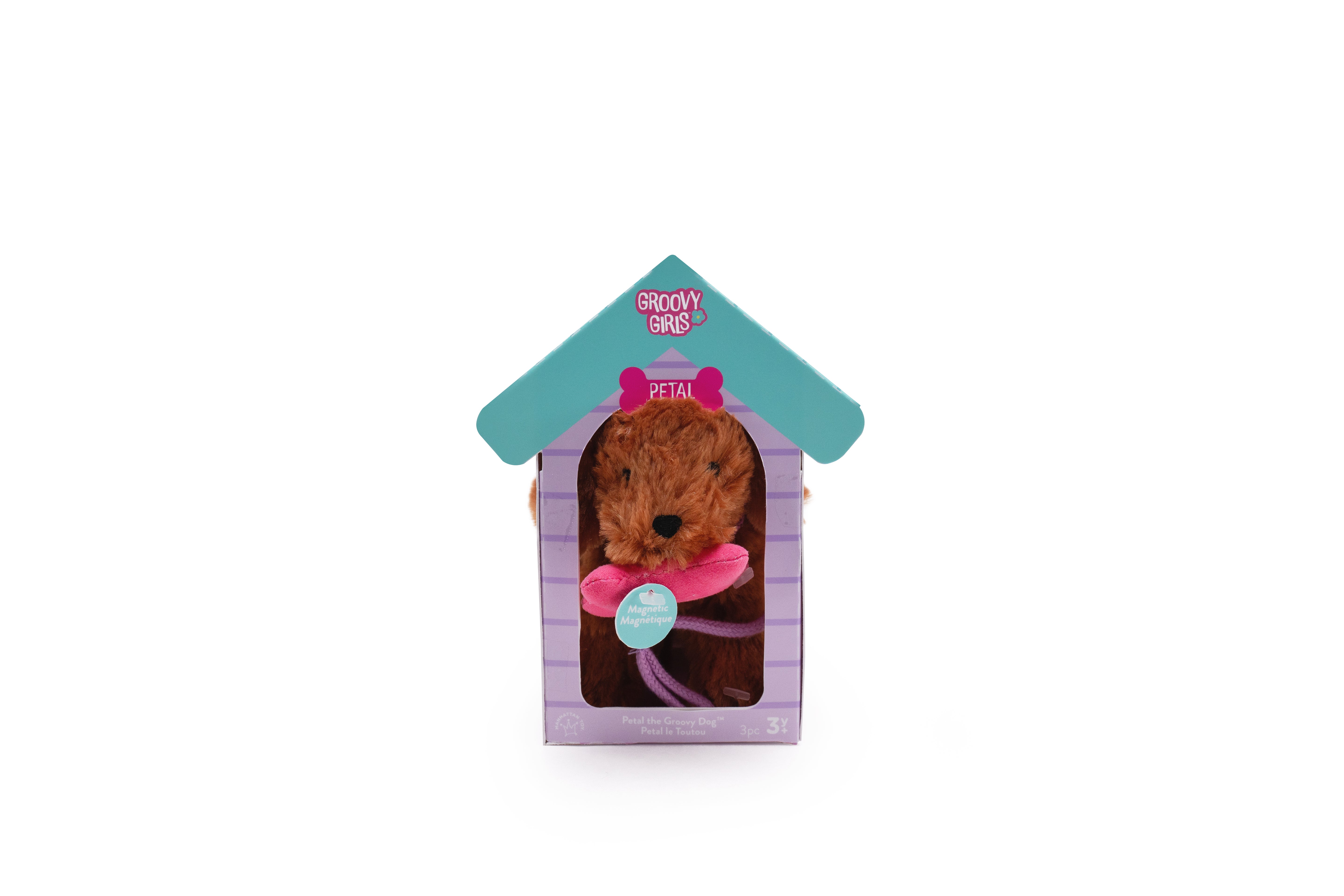 Brown soft dog with pink magnetic bone in its mouth. Inside of a doghouse package.