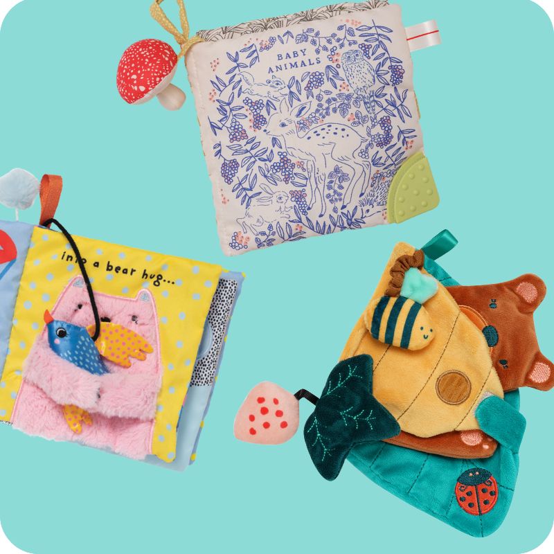 3 colorful soft baby books on a baby blue background