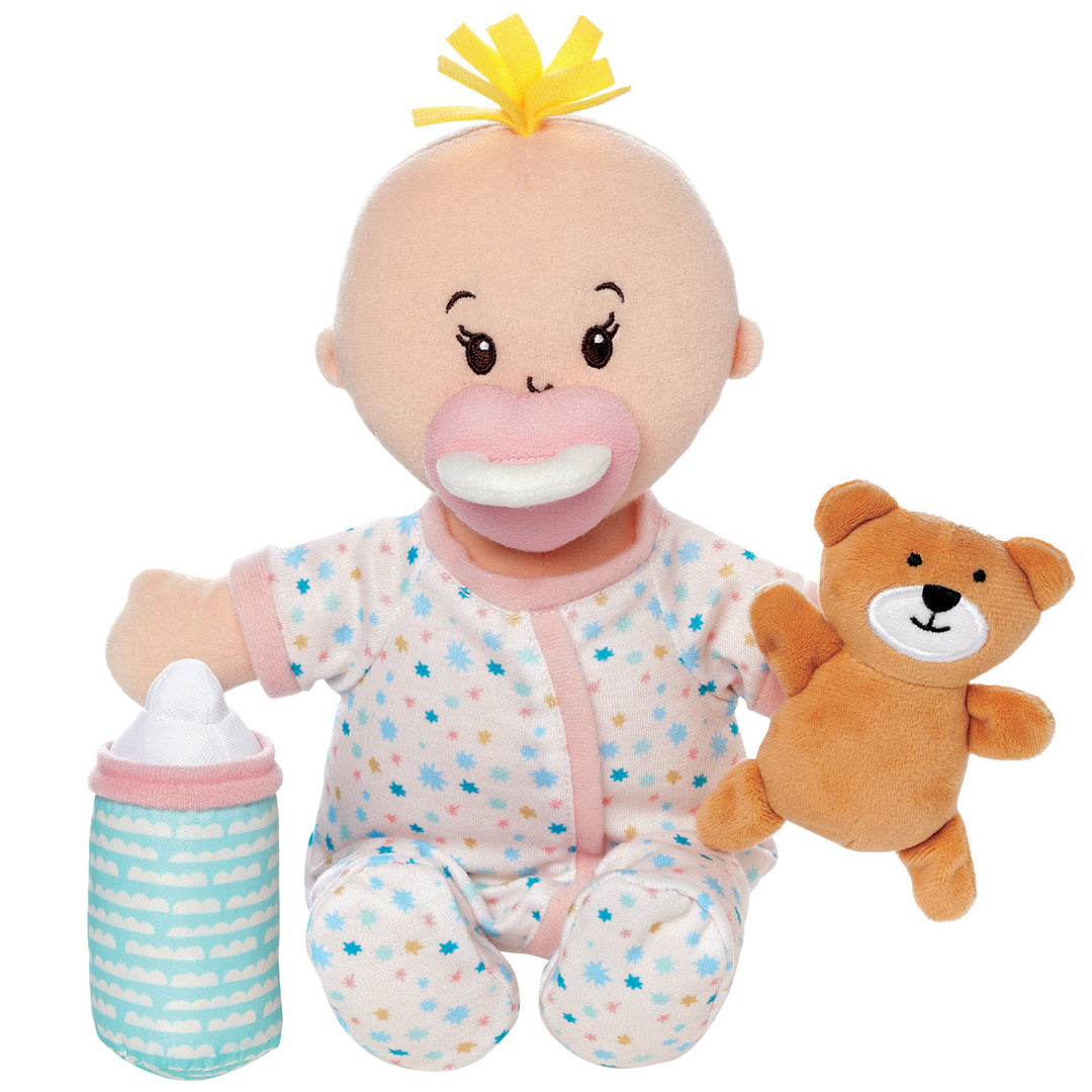 Plush baby doll with pacifier, bottle, and teddy bear on a white background