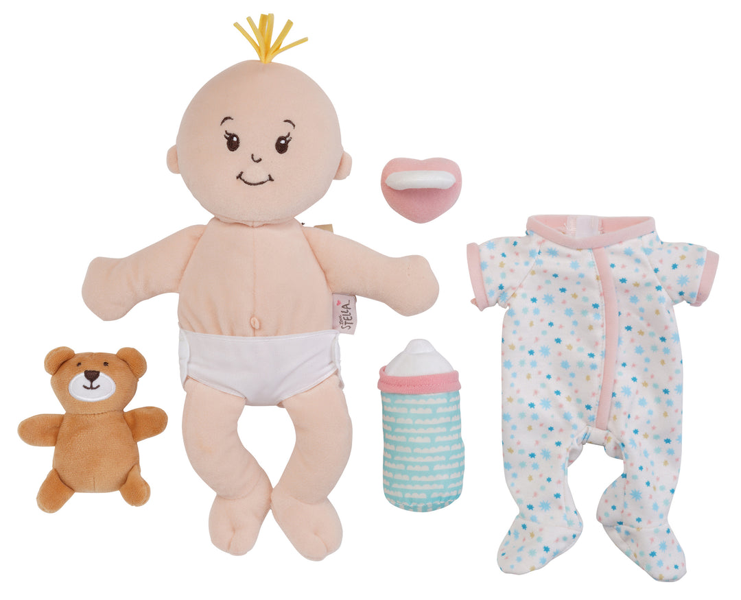 Soft baby doll playset with a blond tuft doll, teddy bear, bottle, pacifier, and star print pajamas.