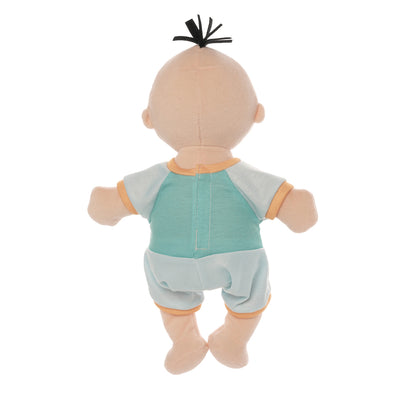 backside of peach skinned soft baby doll with black hair tuft wearing blue short sleeved and shorts romper.
