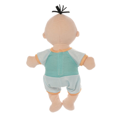 backside of peach skinned soft baby doll with black hair tuft wearing blue short sleeved and shorts romper.