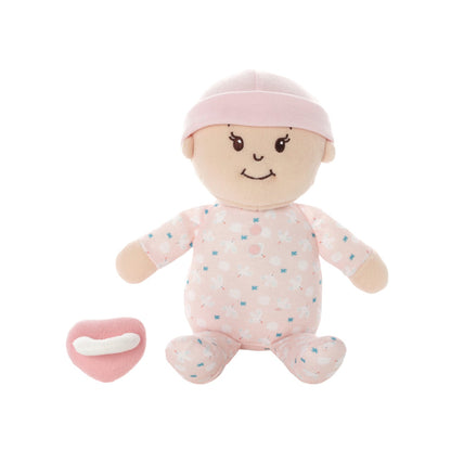 soft baby snuggle doll with peach skin that includes a magnetic pacifier 