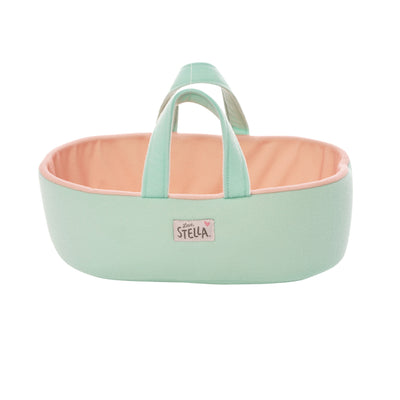 blue and peach colored fabric doll sized bassinet with handles and a love stella logo