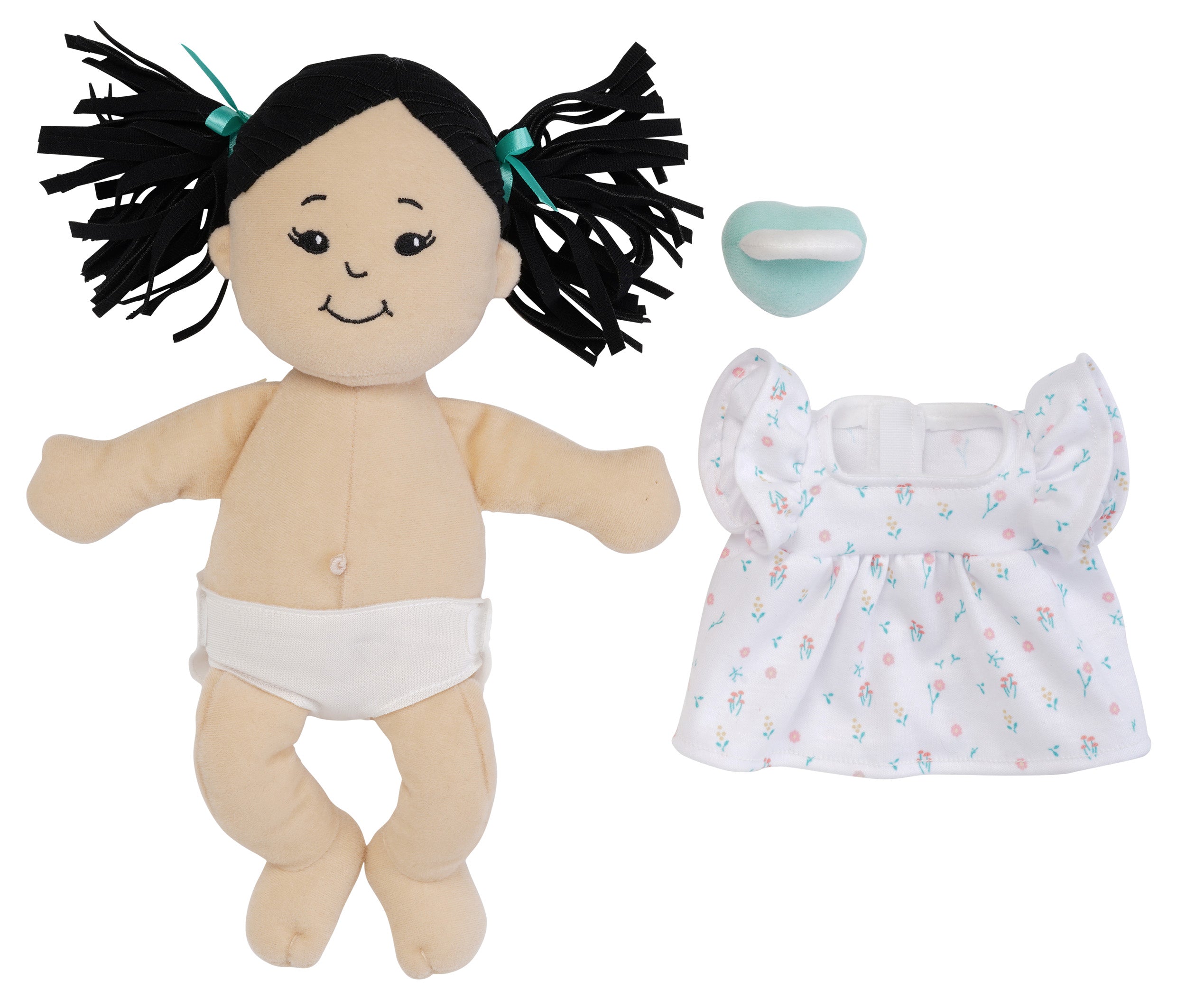 light beige soft doll with dress removed and pacifier off to the side of the doll so you can see the fabric belly button and included removable fabric diaper on the doll.