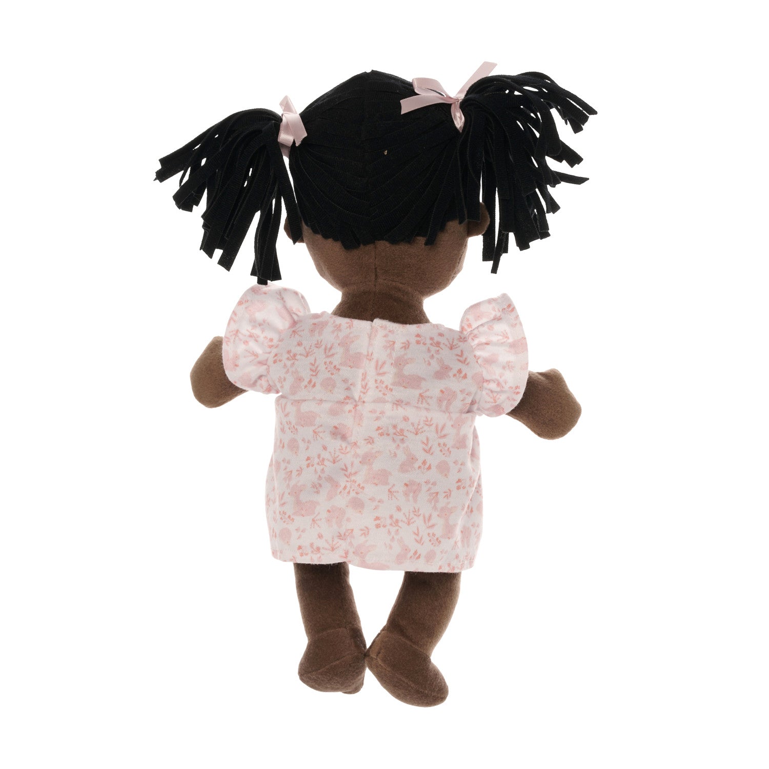 backside of brown skinned baby doll with black pigtails wearing a pink dress.