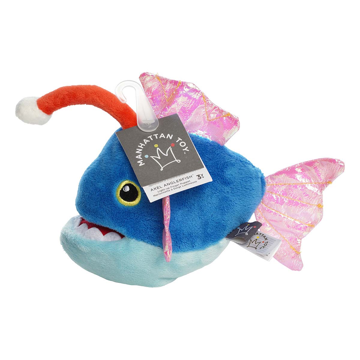 Blue plush fish toy with pink wings and red dorsal fin, branded 'Manhattan Toy'.
