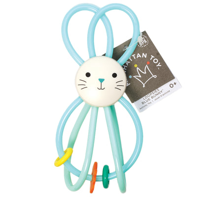 Blue bunny toy with a face on a white background, featuring Manhattan Toy hangtag.
