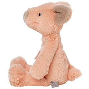 Pink plush pig toy on a white background