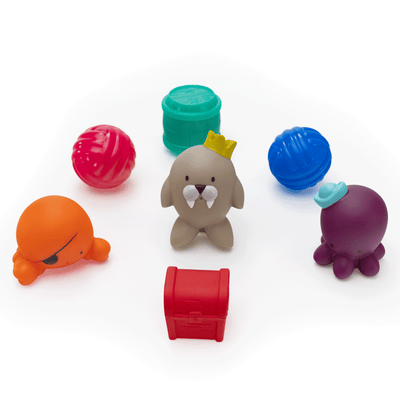 Bath toy pieces including crab, walrus, and octopus characters and various shapes.