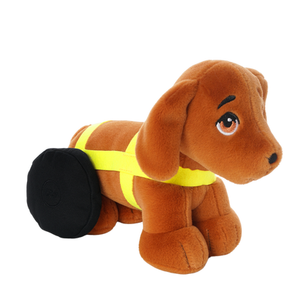 Brown plush dachshund toy with floppy ears, expressive embroidered eyes, and black wheels on its back legs, wearing a bright yellow harness.