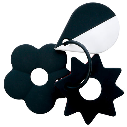 Black and white baby teether set with geometric shapes, including a flower, starburst, and droplet, connected by a circular ring.