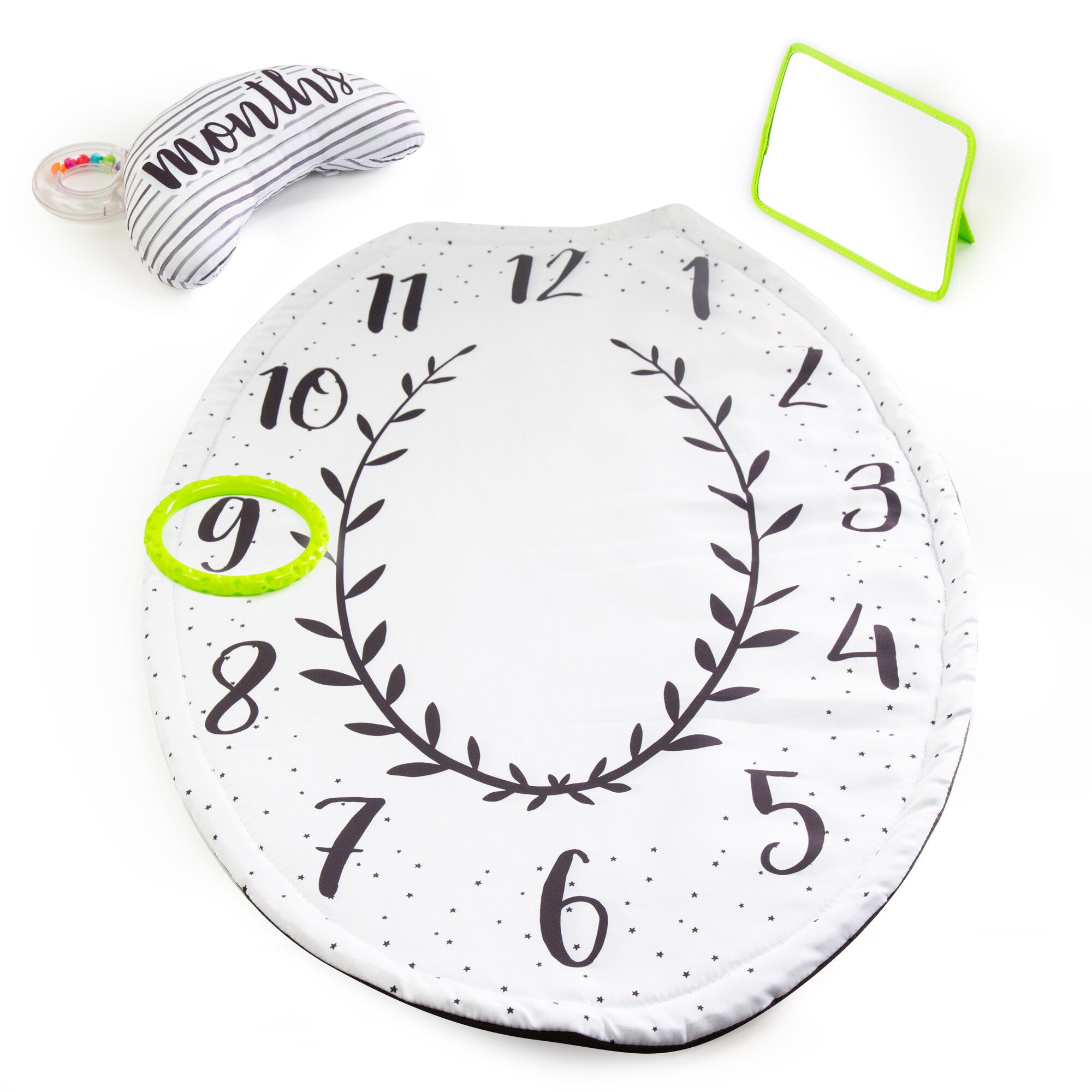 Round milestone mat with numbers and a wreath design, featuring a baby's first birthday hat and mirror on a white background.