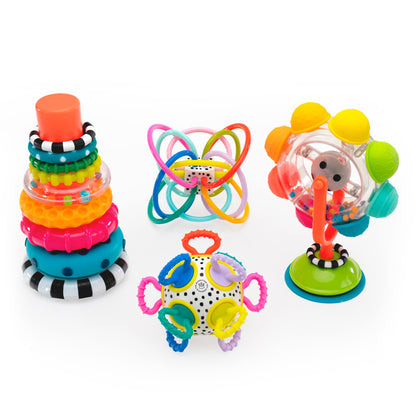 Group visual of a colorful ring stcking toy, spinning wheel toy with suction base, and two colorful round grasping and teething toys.