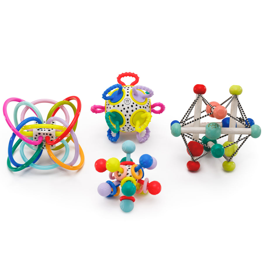Group visual of colorful winkel teether rattle, plastic sensory ball, atom teether toy, and a wood Skwish rattle and sensory toy.