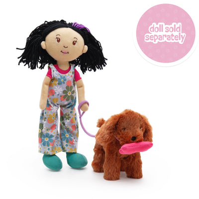 Soft doll holding leash with a soft brown dog holding a magnetic bone in its mouth. Doll sold separately callout