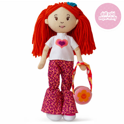 soft doll wearing a white t-shirt with a colorful heart, pink animal print pants, and flower purse.