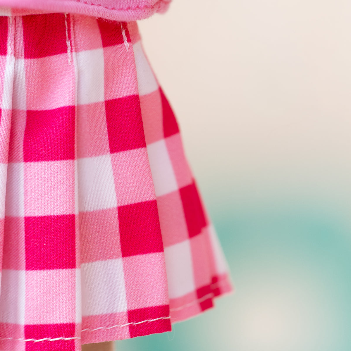 close up of pink and white gingham soft doll skirt 