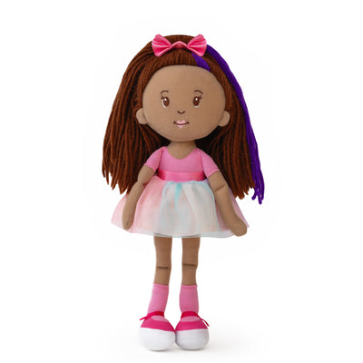 Doll with brown hair, pink dress, and pink bow on a white background