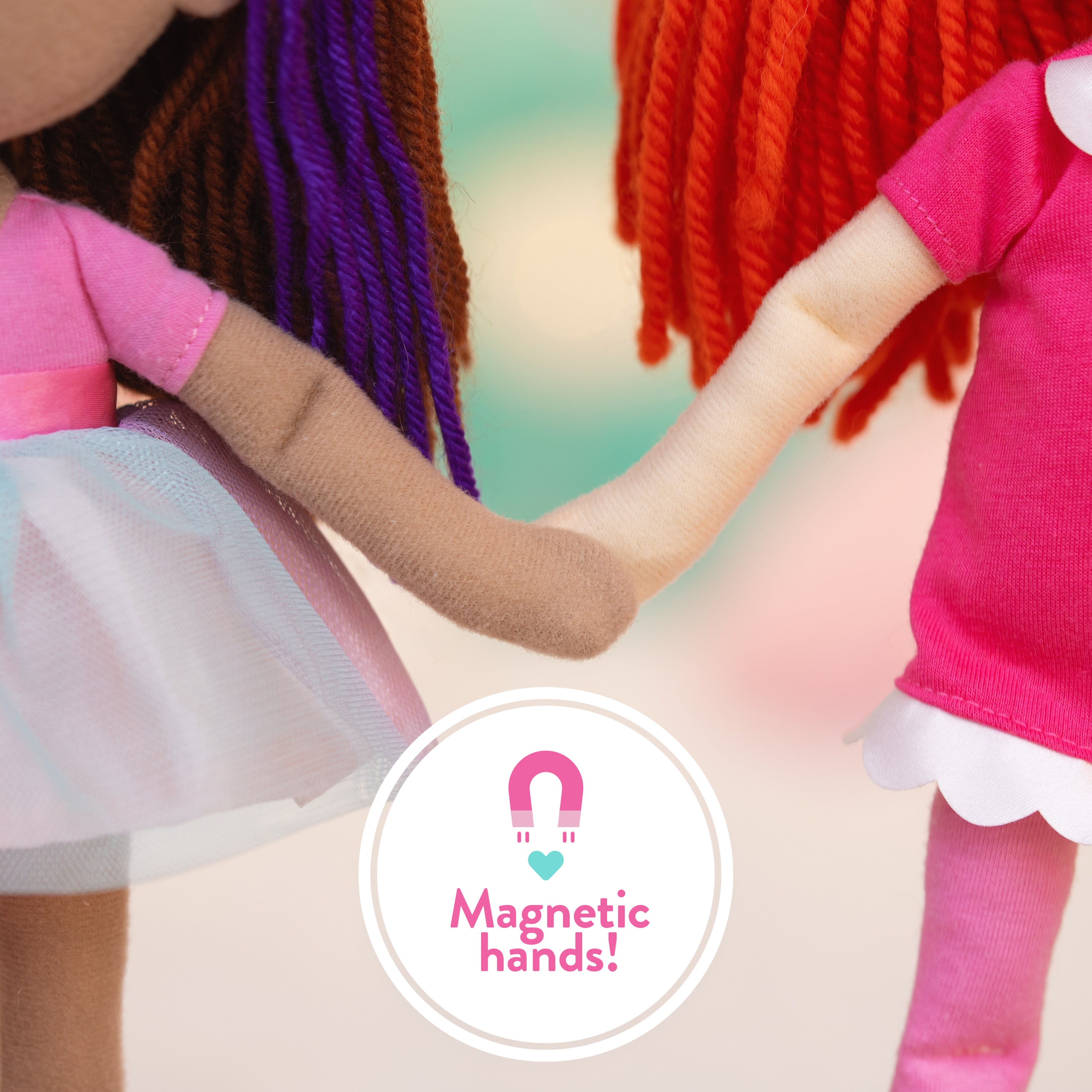 Two dolls holding hands with a 'Magnetic hands!' label in the center.