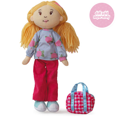 Soft doll wearing a floral patterned shirt with pink corduroy pants and a pink duffel bag.