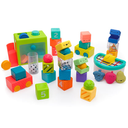 Group visual of colorful plastic stacking blocks, a fruit fill n spill toy and a coin drop set. 