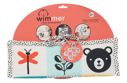 Wimmer infant development 3-in-1 Play Mat for ages 0+, featuring high-contrast designs including a red dragonfly, black leaves, and a bear face, with a black-and-white polka dot trim and tie for easy storage.
