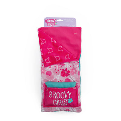 Pink doll sleeping bag with reversible patterns, pillow, and pillow pocket. In packaging.