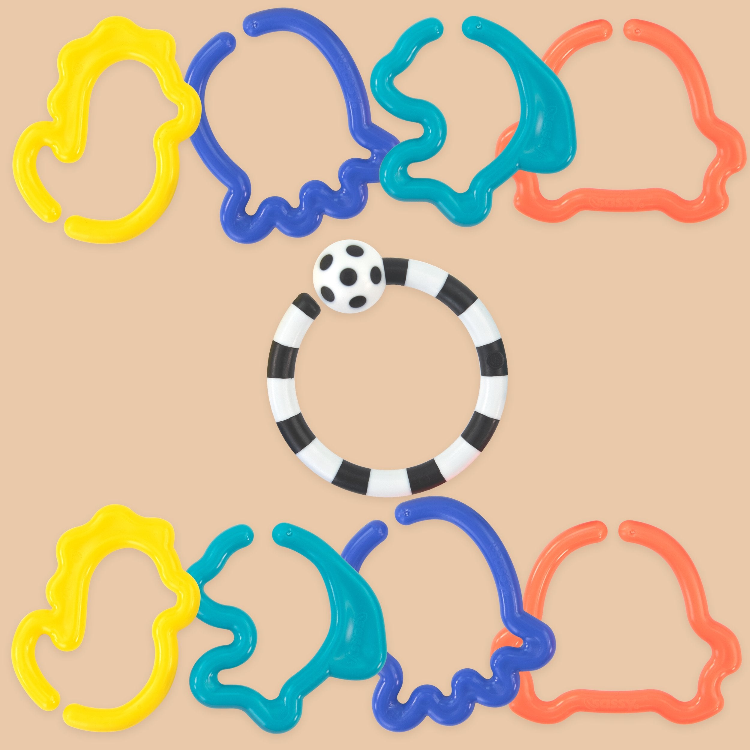 Colorful plastic rings on a beige background