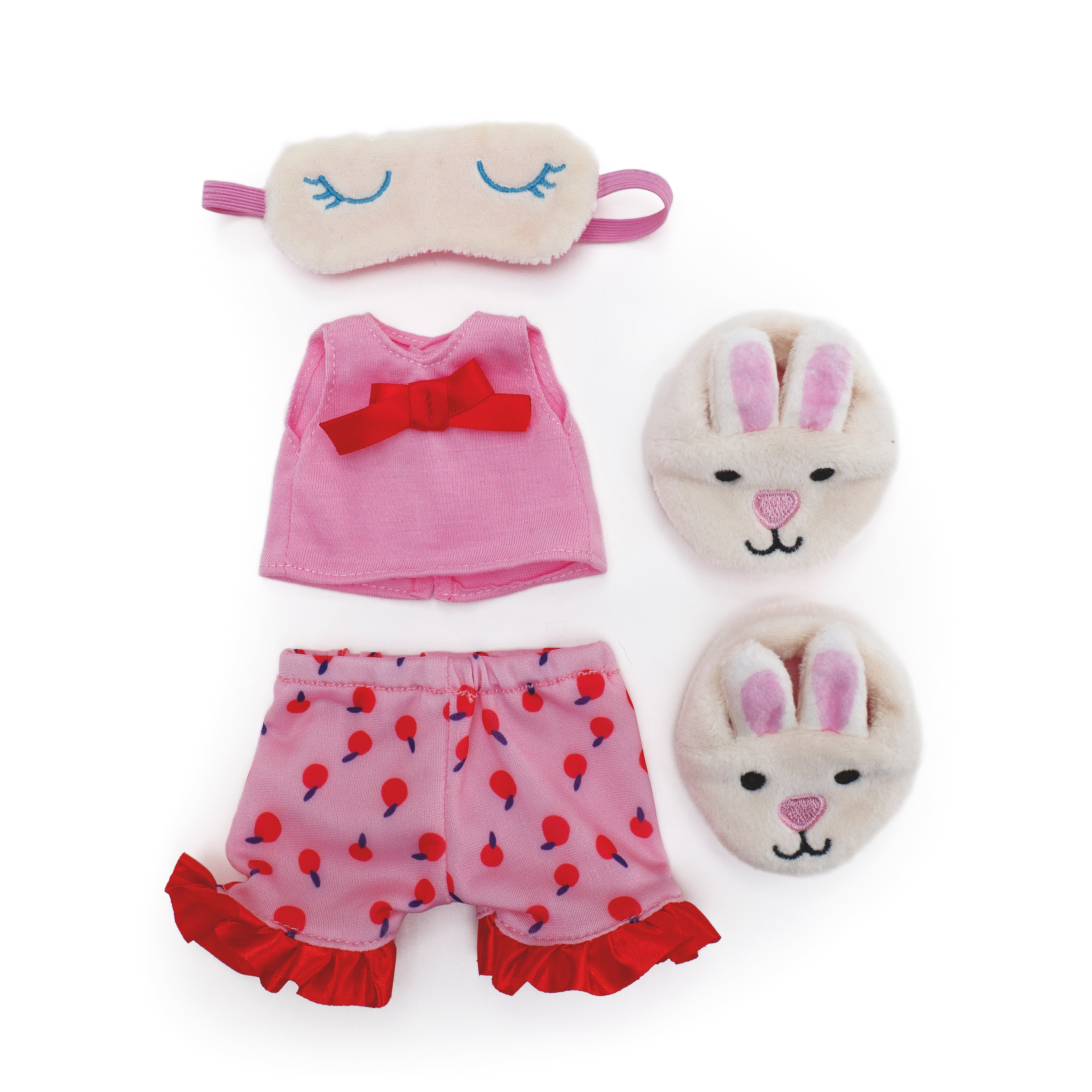 Doll pink pajama set with cherry pattern shorts, bunny slippers, and sleep mask.