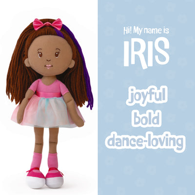 Doll named Iris with brown hair and a pink outfit on a white background: joyful, bold, dance-loving