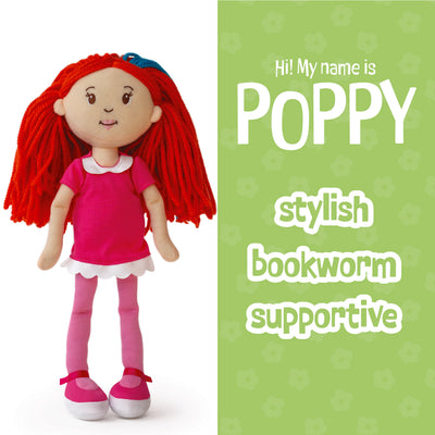 Groovy Girls Poppy doll with red hair and pink outfit on a white and green background with text about the doll's personality: stylish, bookworm, supportive
