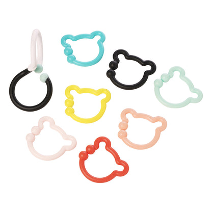 A black and white S-shaped hook next to 7 colorful bear-shaped rings.