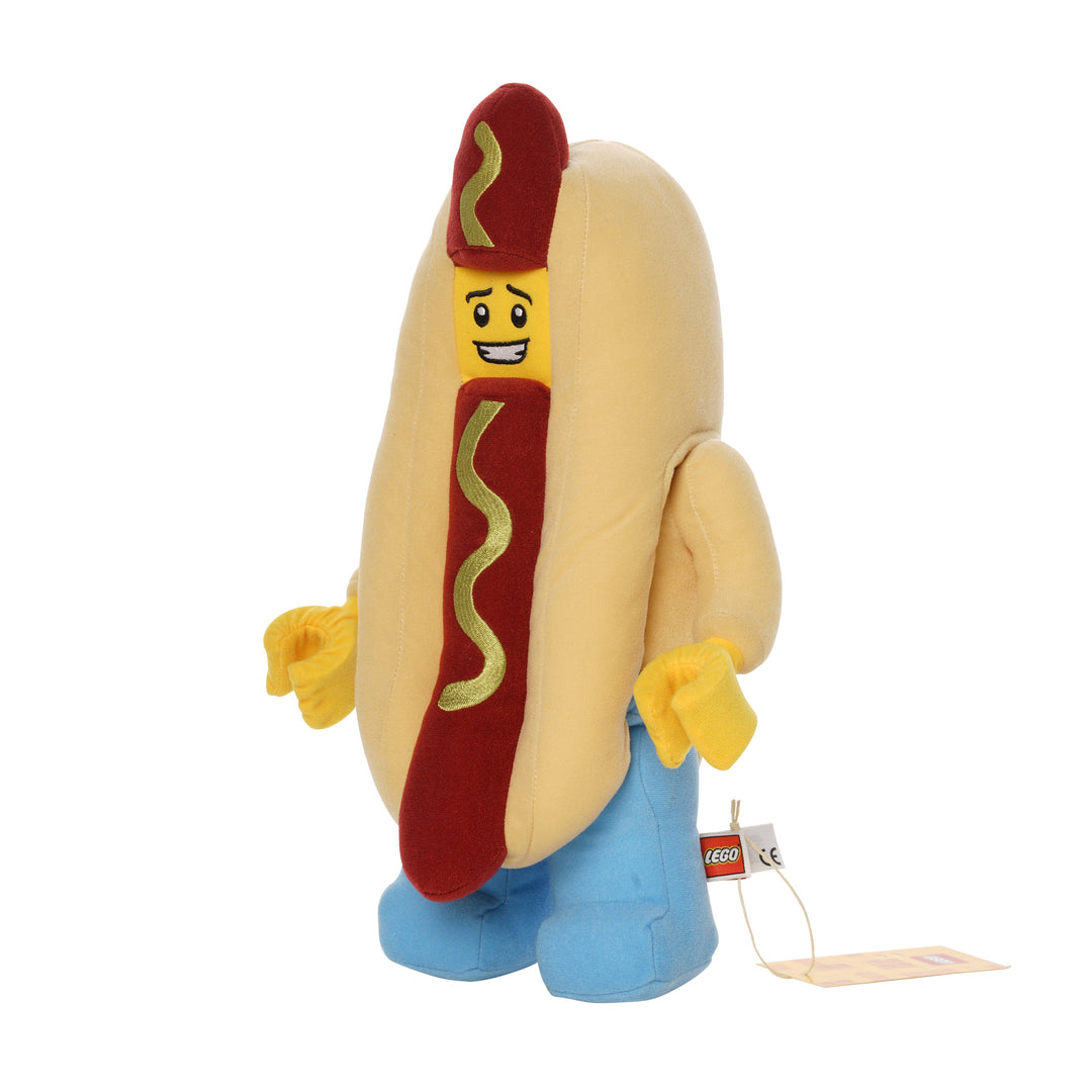 Hot dog costume plush inspired by LEGO with smiling yellow face, red hot dog center, and light blue legs.