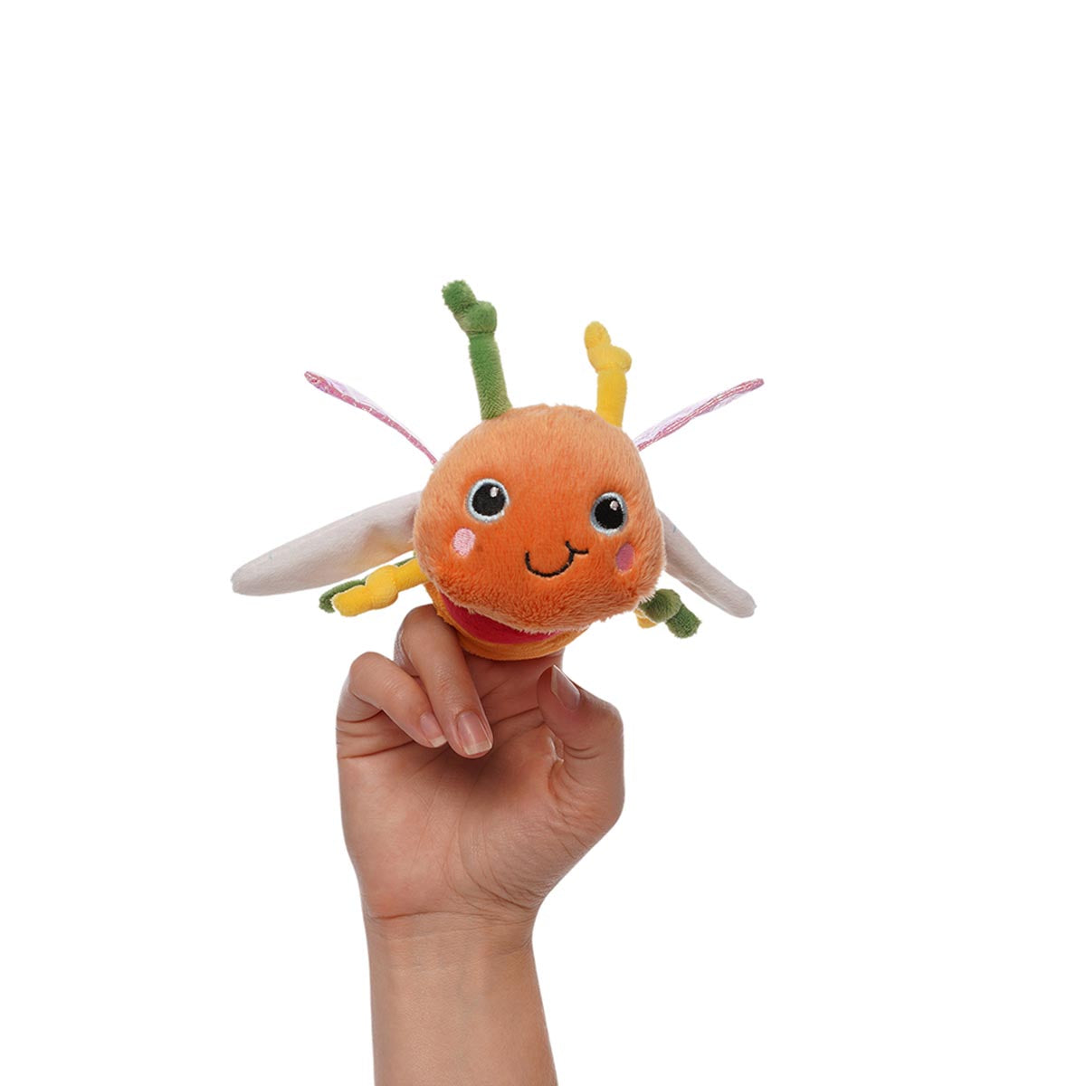Hand inside plush dragonfly puppet with an orange head, multicolored body, legs, and antennae, and pink and white wings.